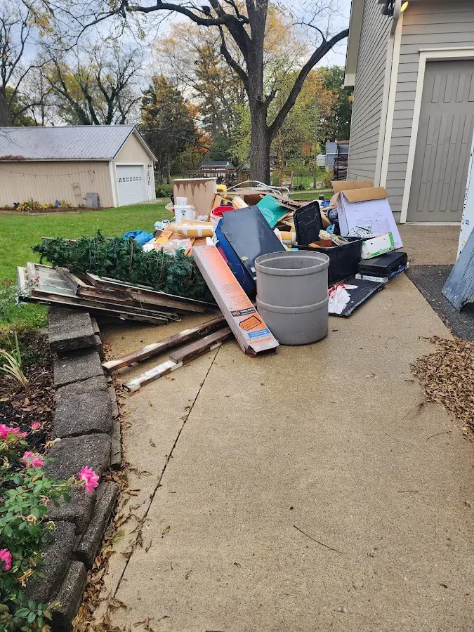 Dumpster being loaded with debris for 3 Yard Dumpster Rental in Augusta